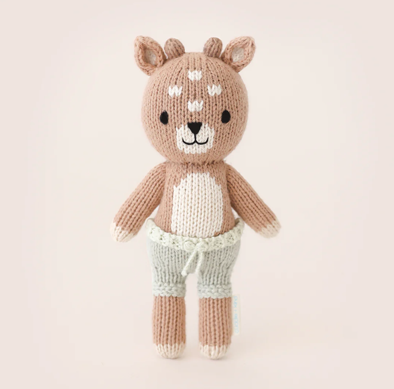 Hand-knit Tiny Elliot the Fawn doll, soft cotton yarn, safe for newborns, giving 10 meals to children worldwide.