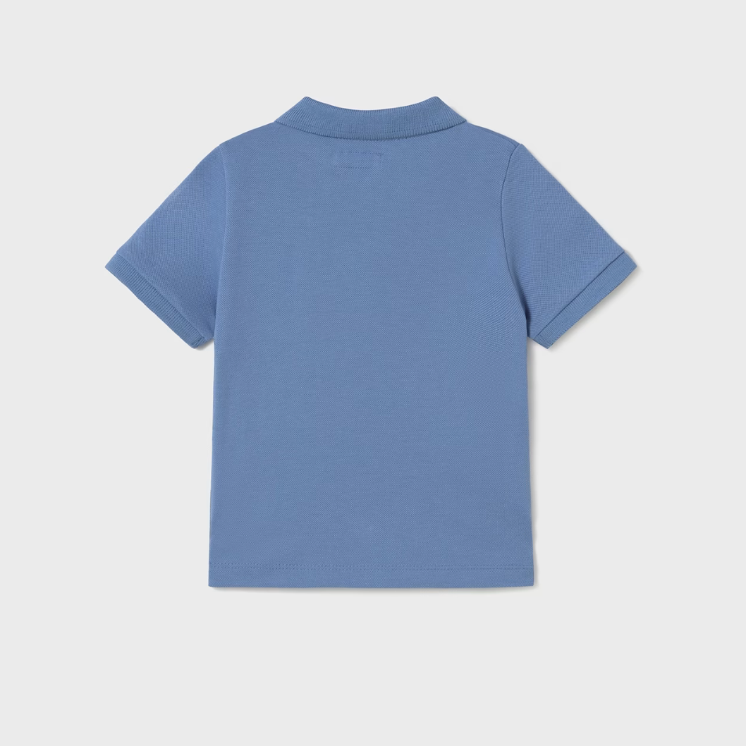 Boy’s blue polo shirt with collar and buttons, made from 100% cotton.