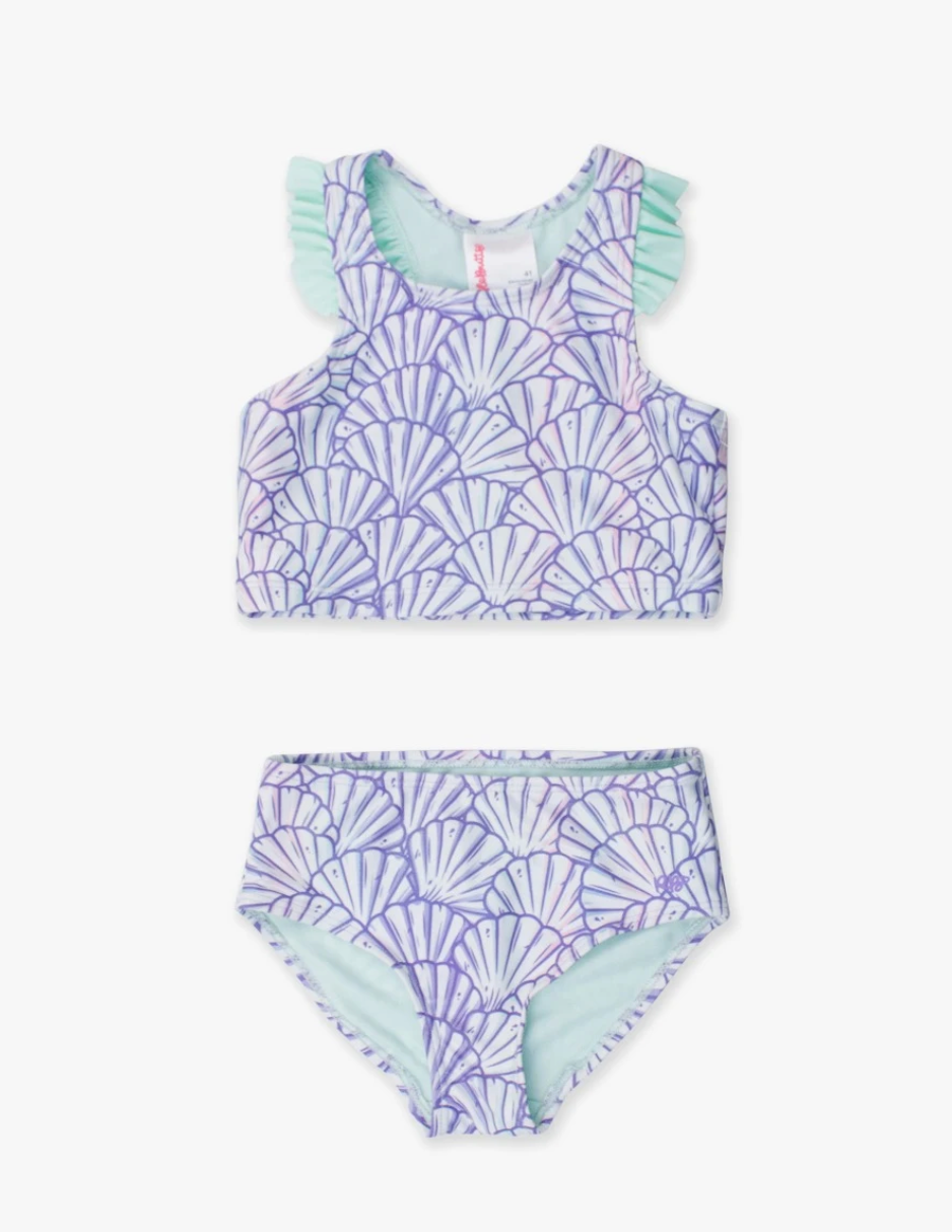 Young girl’s purple mermaid-themed racerback tankini with flutter ruffle straps, shown in two-piece set on white background.