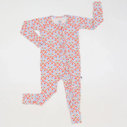 Red, white, and blue floral bamboo baby zippie with ruffle trim and foldover cuffs, perfect for patriotic holidays or everyday comfort.
