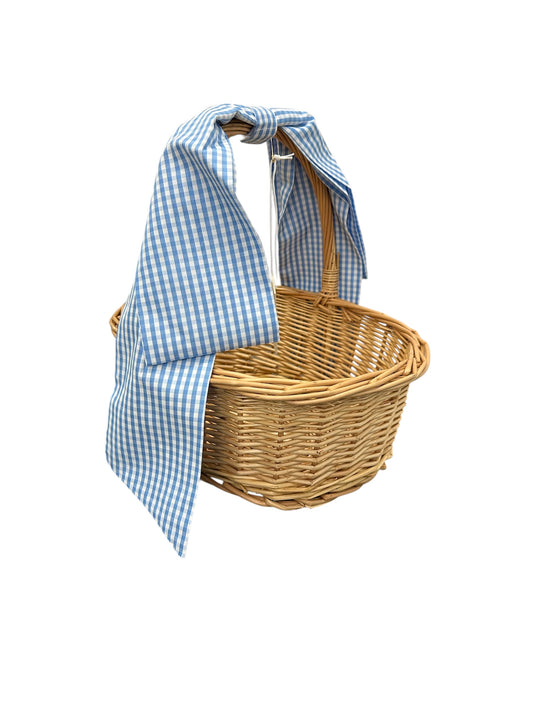 Assorted handwoven Easter baskets with bows in round and oval shapes, available in multiple sizes and finishes.