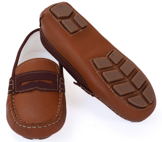 Boys’ two-tone leather slip-on penny loafers in natural and copper colors with cushioned insoles.