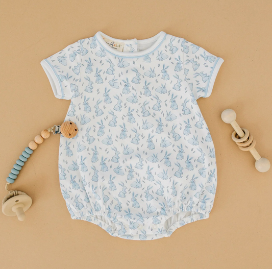 Dress your little one in sweet Easter style with the Luna & Arlo Bunny Patch Bubble in light blue. Made from ultra-soft 100% Pima Cotton, this charming bubble features an allover bunny print that’s perfect for springtime photos, egg hunts, and family gatherings. Snap closures make diaper changes a breeze while the breathable fabric keeps baby comfy all day long.

Whether you're planning a holiday brunch or a cozy spring outing, this one-piece is an adorable keepsake for baby’s first Easter—and coordinates b