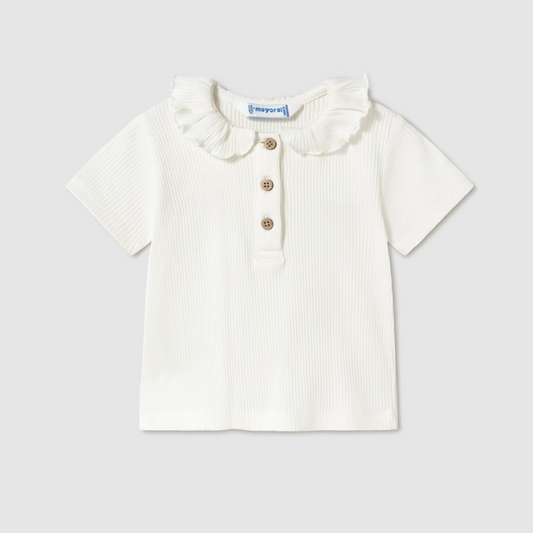 Cream ribbed girls’ long sleeve top with ruffle collar, perfect for layering or wearing alone.