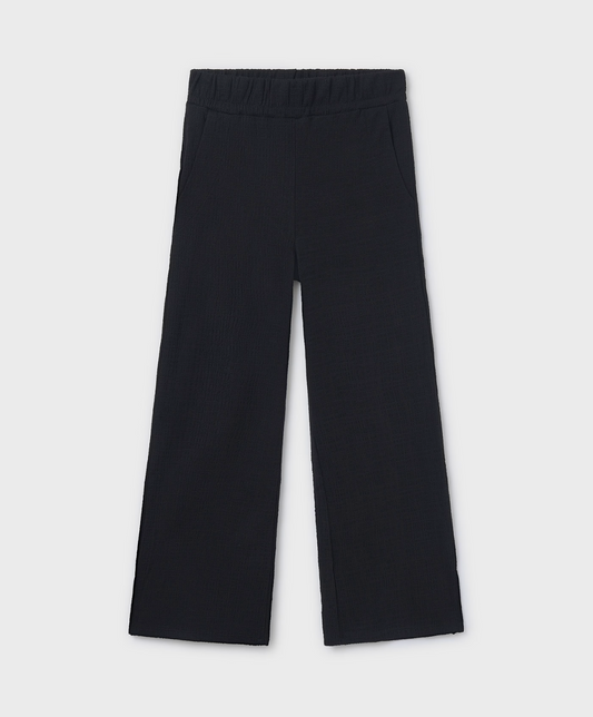 Mayoral Tween black wide leg pants for girls, made from a textured cotton-blend fabric with added stretch, featuring a relaxed silhouette, displayed flat on a white background.