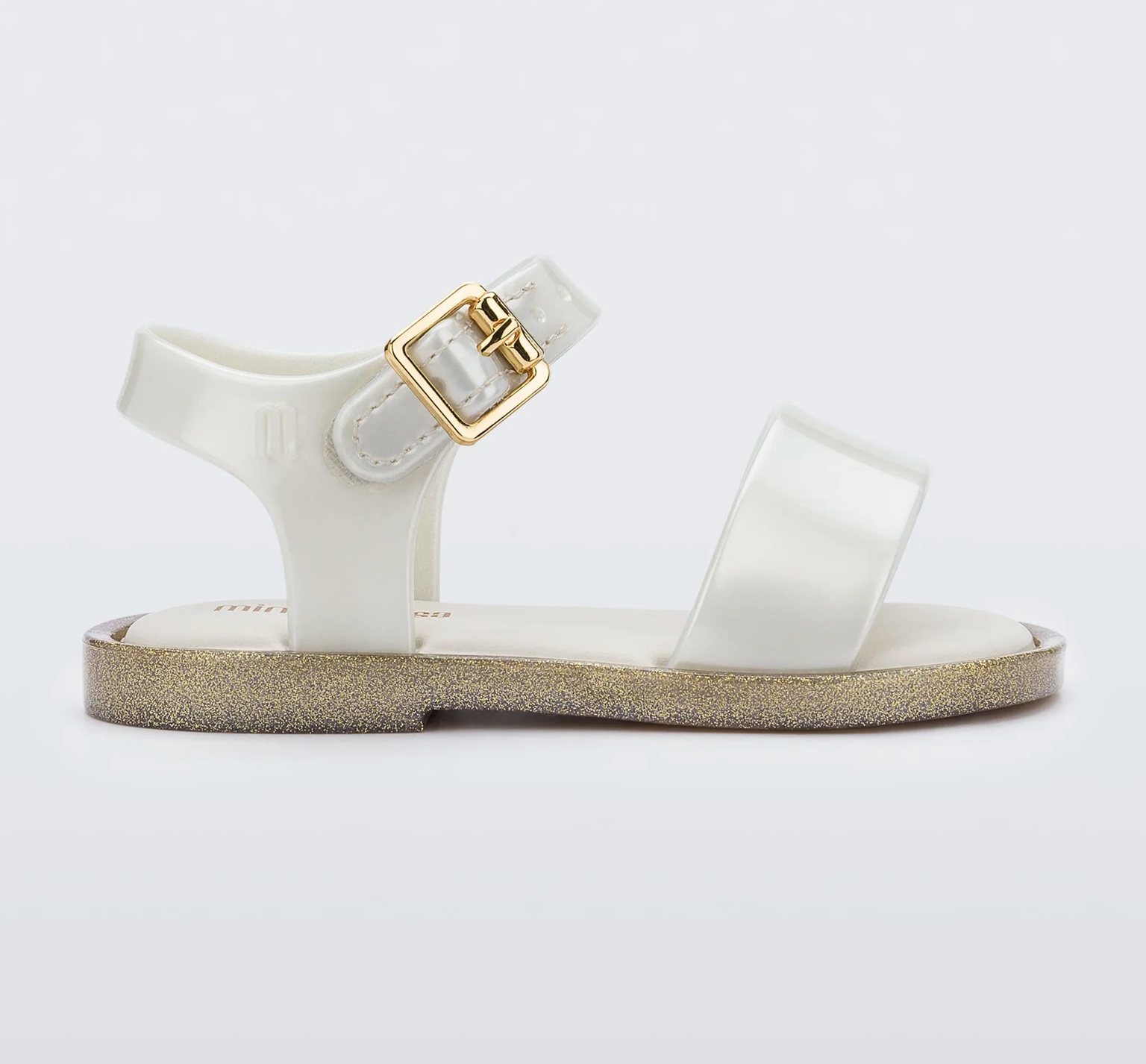 Toddler wearing Mini Melissa Mar Sandal in classic design, durable and comfortable footwear for active kids.