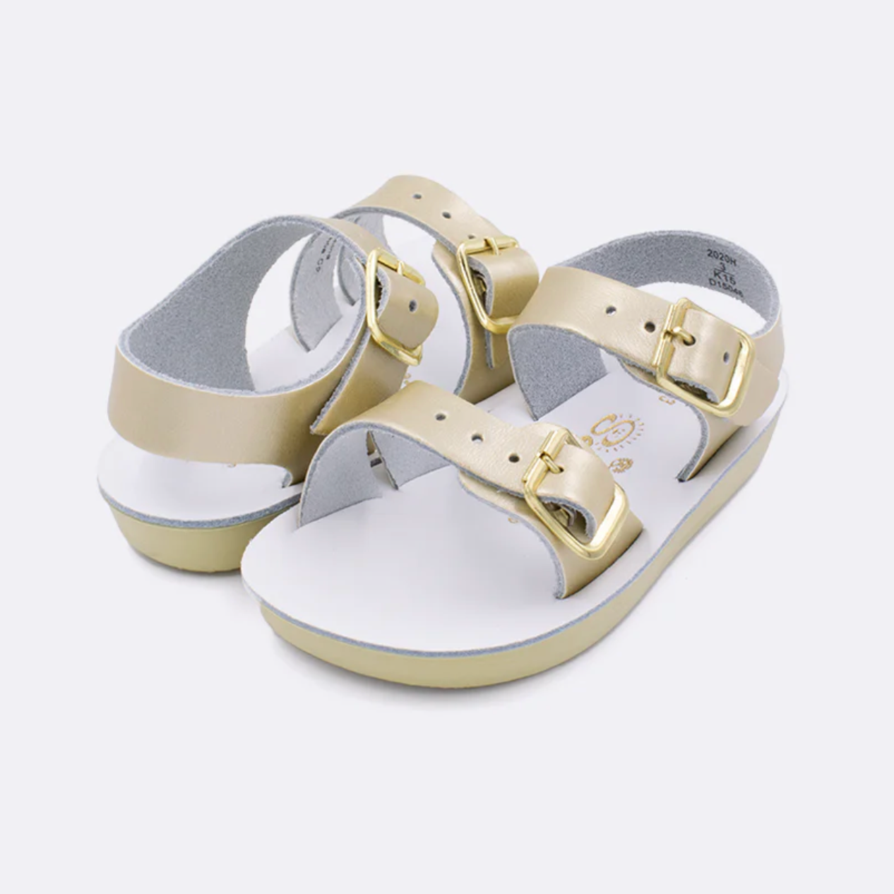 Infant gold leather sandal with adjustable buckles and flexible sole, water-friendly and soft for baby’s first steps.