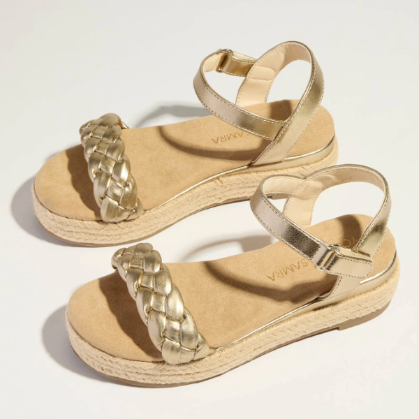 Girl wearing Yosi Samra Miss April Wedge Sandals with espadrille platform and braided toe strap, secure Velcro ankle closure.